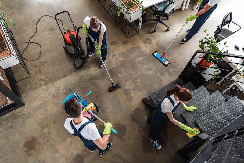 A birdseye view of cleaners in an office