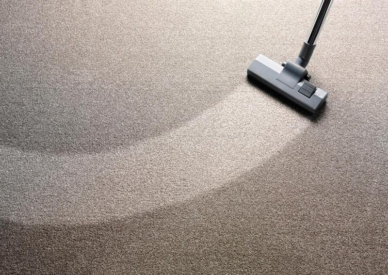 A hoover cleaning a carpet